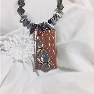 Necklace with metal pendant